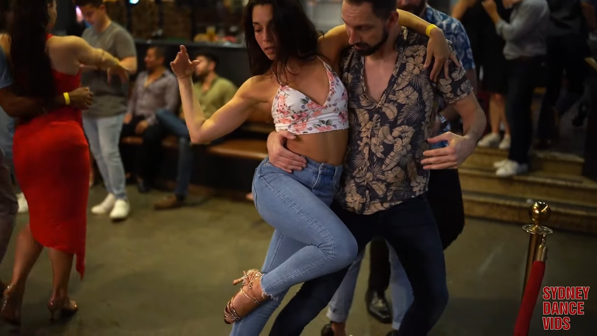 Man and woman dancing together in casual clothes in a club on a social dance event